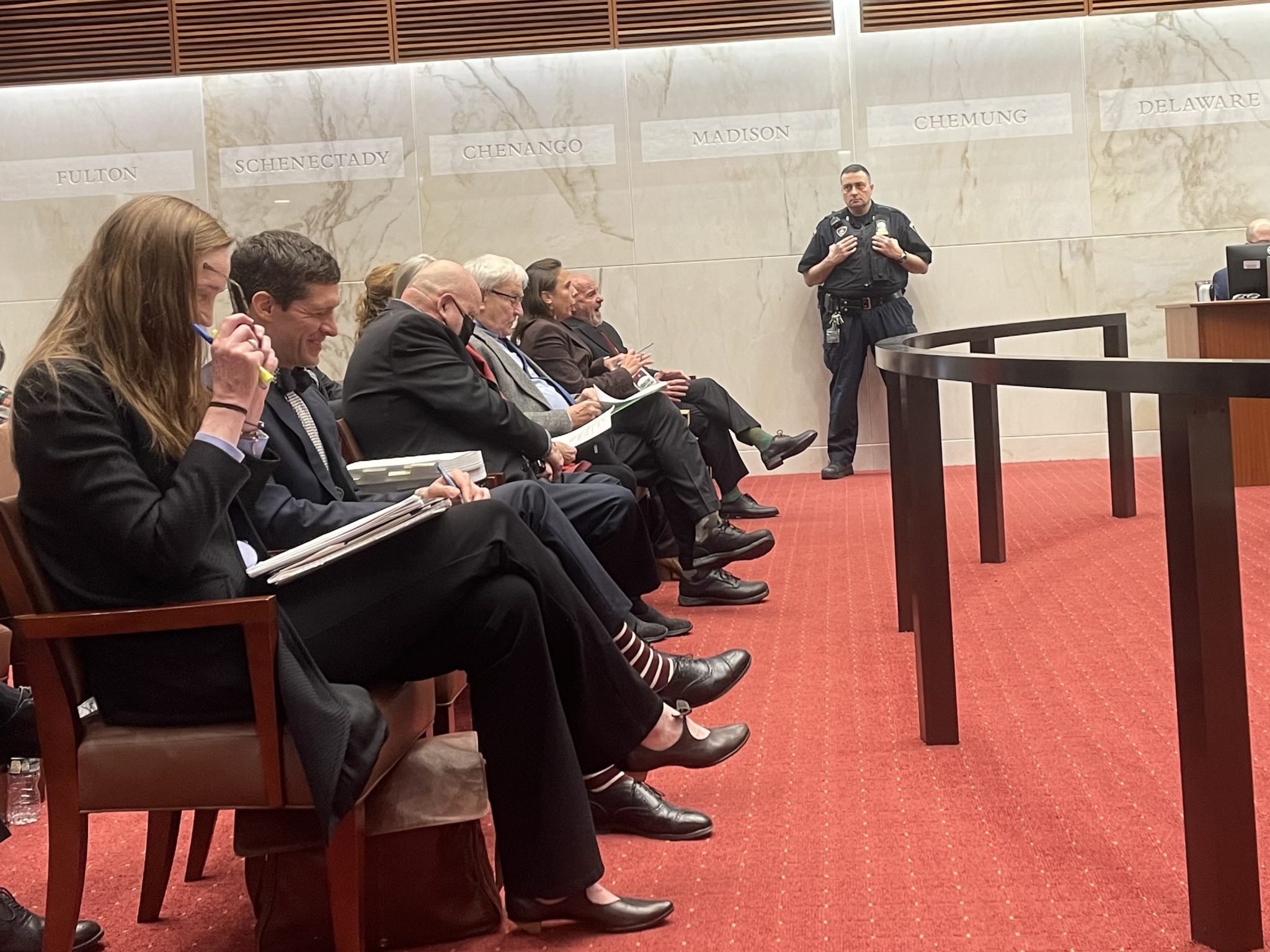 Former DEC Commissioner Thomas Jorling, center in gray suit, and lawyers before a hearing at the Appelate Division of the state Supreme Courty's Third Department. Photo by Zachary Matson