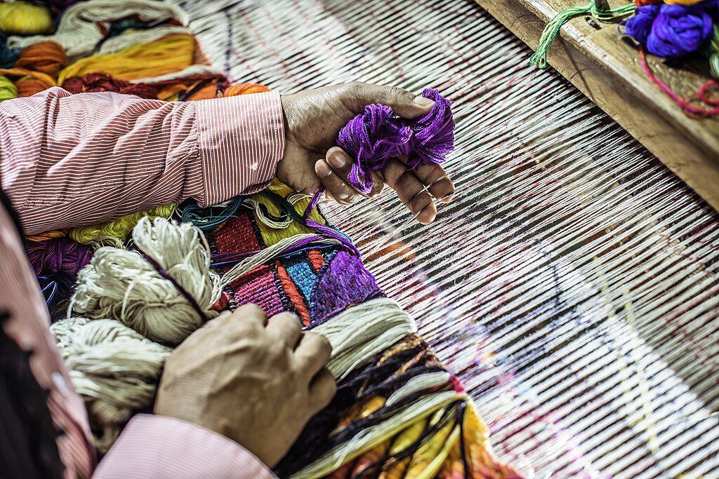 tapestry weaving: credit of Maximo Laura, CC BY-SA 4.0 , via Wikimedia Commons