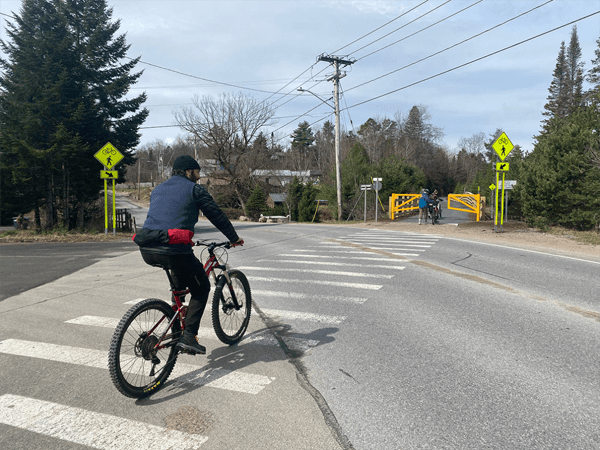 Biker uses a crosswalk
