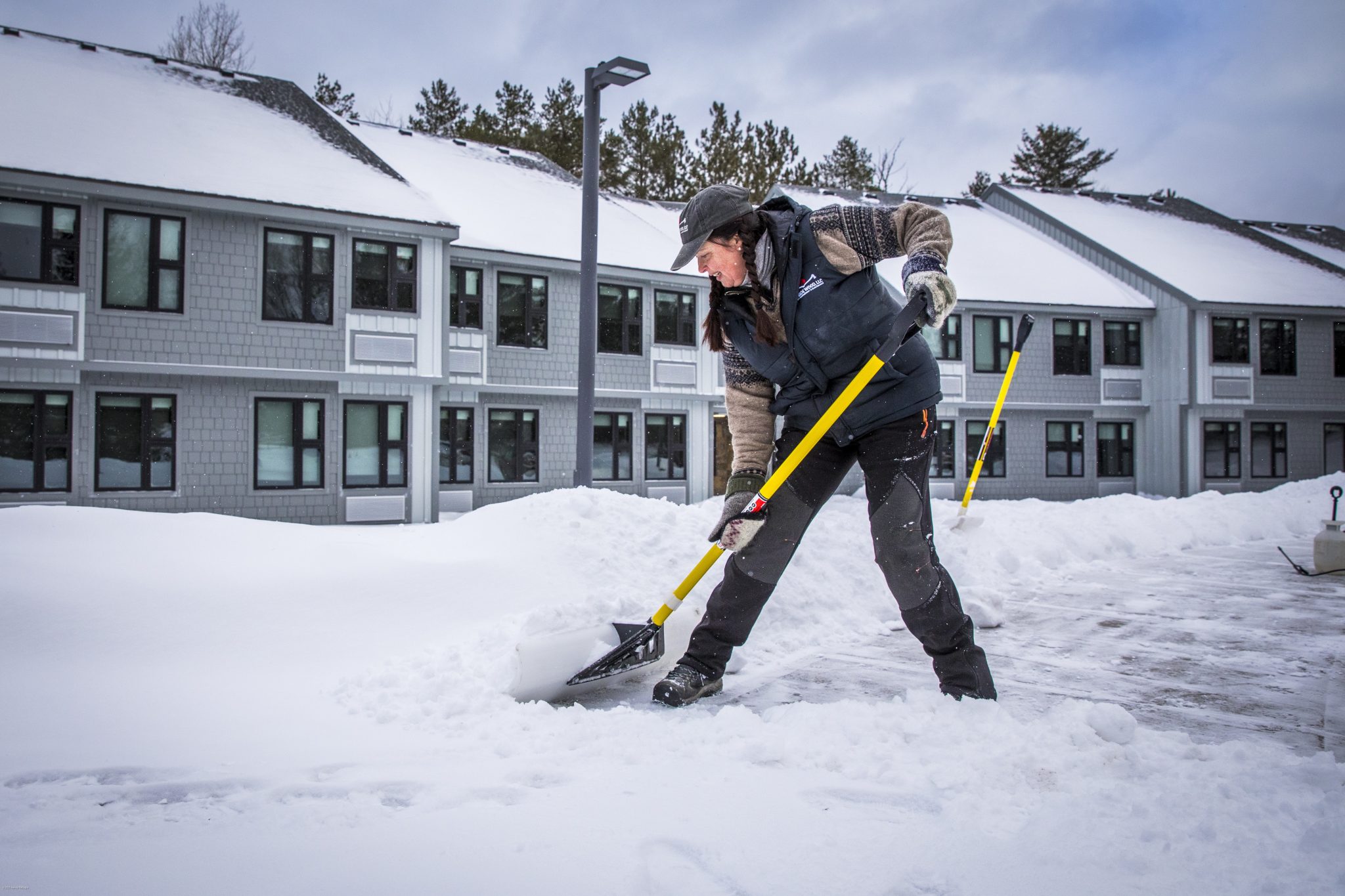 woman shoveling snow
